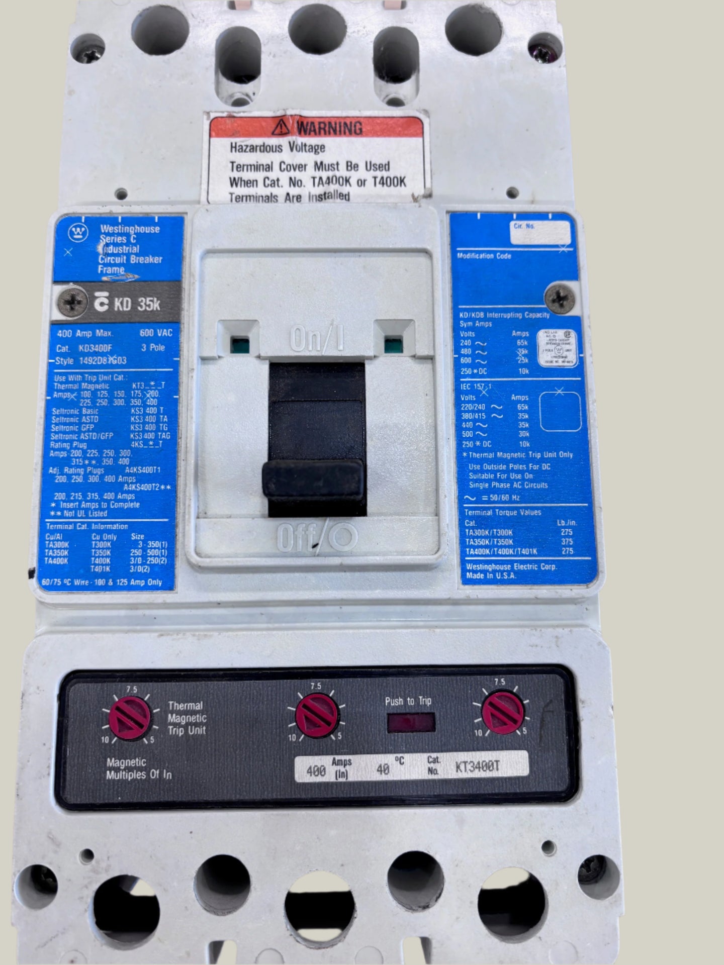 A silver-colored Eaton/Cutler Hammer circuit breaker with a blue label on the upper part and red adjustment knobs on the front panel.